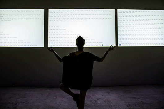 Fenia Kotsopoulou in front of "You like my like of your like of my status" at the Athens Digital Arts Festival, photo by Daz Disley